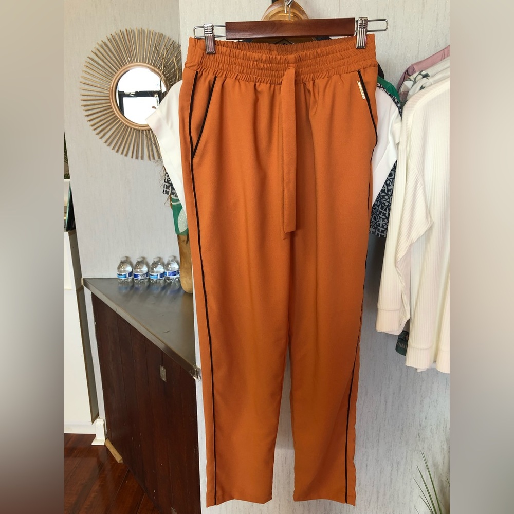 Orange pants.
